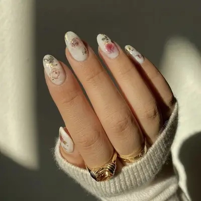 flower tapestry milky bath nails closeup