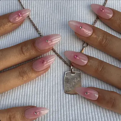 Close up of a glittery pink on pink French manicure