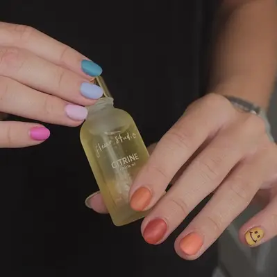 rainbow nails with smiley faces