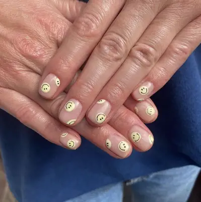 nails with yellow smiley faces