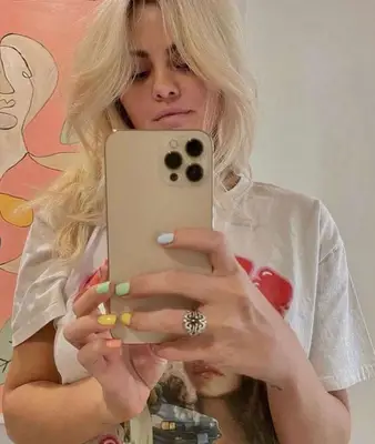 Selena Gomez with rainbow nails