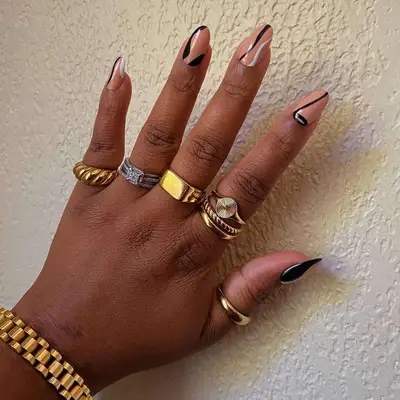 abstract black, white, and peach manicure