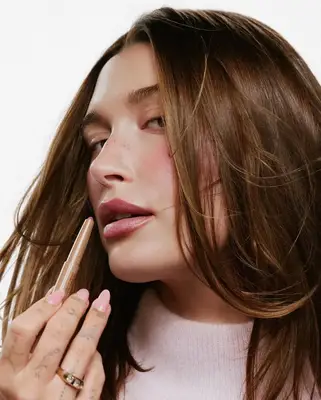 Hailey Bieber with a sheer pink manicure