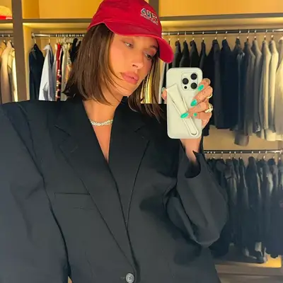 Hailey Bieber wearing mint green almond mani