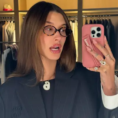 Hailey Bieber wearing pale pink almond mani