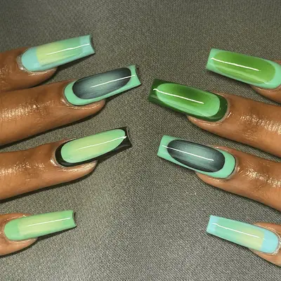 Long square nails with multicolored green aura designs