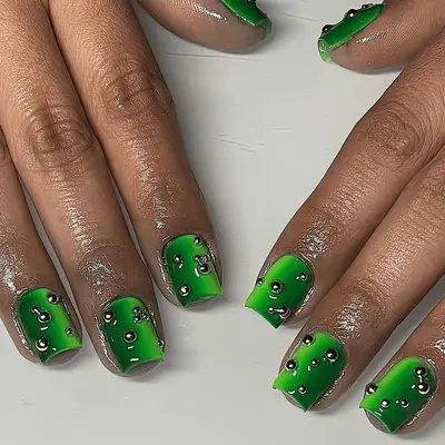 Short square velvet green nails with silver studs