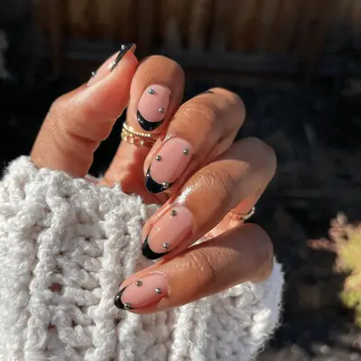 Black French manicure with silver studs