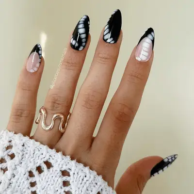 black french nails with white tie dye designs