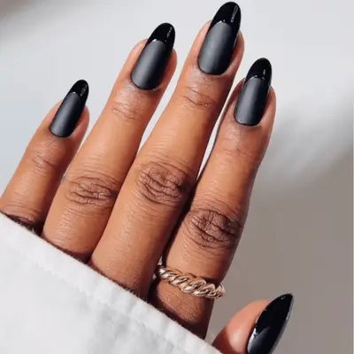 Black matte manicure with glossy tips
