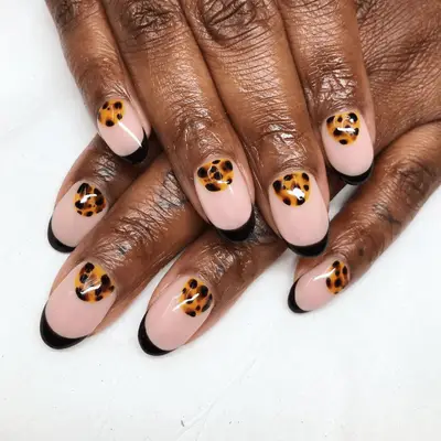 Black french manicure with tortoiseshell accents