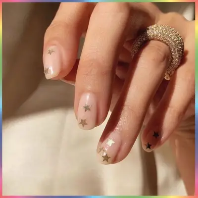 Hand with star manicure