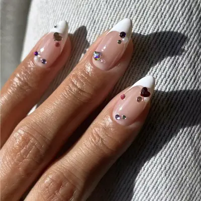 heart-shaped rhinestones on classic french mani