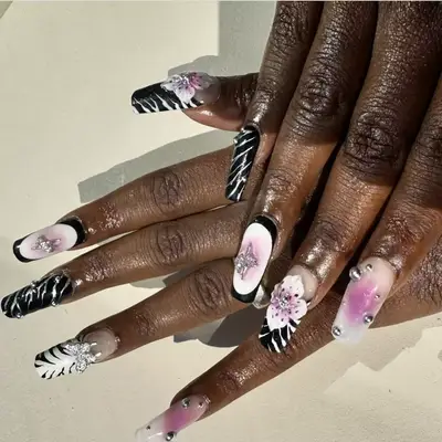 nails with of zebra print, big buds and rhinestones 