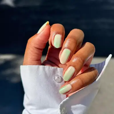 model with ombre beige and mint nails