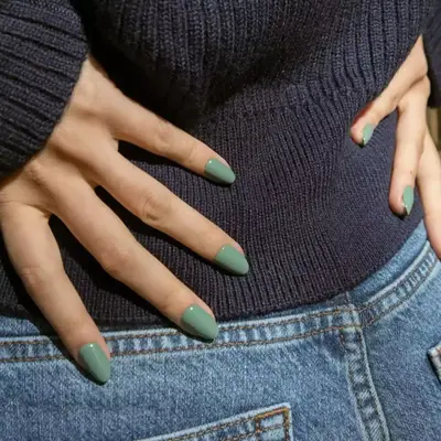 Model with medium green nails