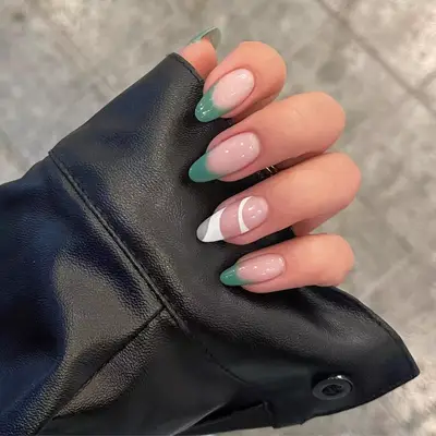 model with green nails with French Tip and white abstract design
