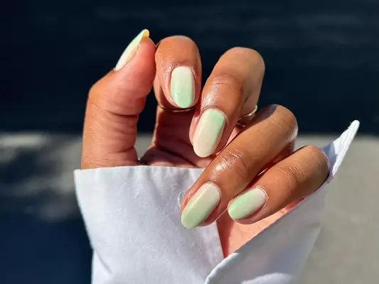 a milky matcha green ombre manicure 