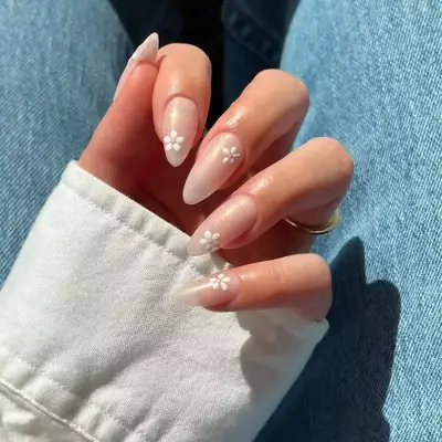 sheer shimmery nails with white flower designs