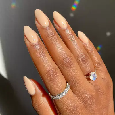 nude manicure with colorful cuticle designs