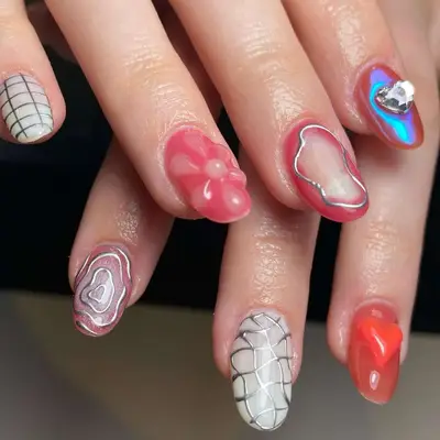 a mismatched mani with flowers, auras, chrome, and cyber designs