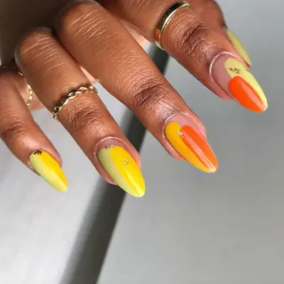 an orange and yellow simple swatch manicure