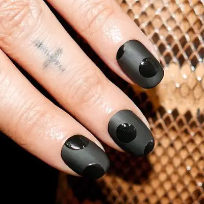 Black matte nail design with glossy black dots