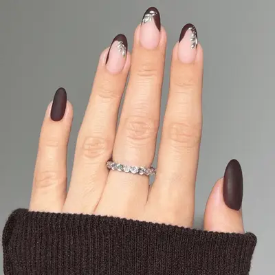 Matte burgundy mani with metallic silver leaf details