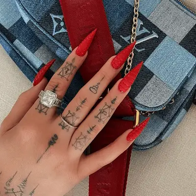 ultra red pointy stilletto nail manicure