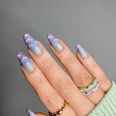 purple and blue cloud designed stilletto nails