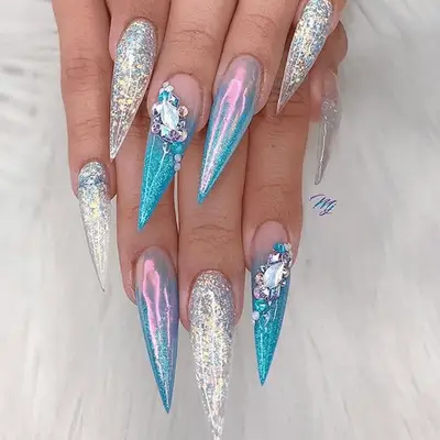 mermaid themed manicure on stilletto nails