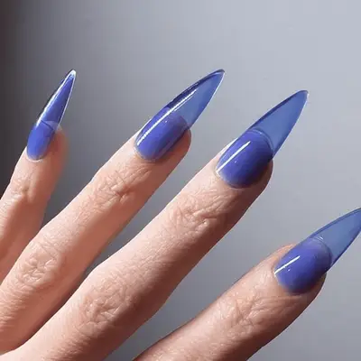 transparent blue tipped stilletto nails
