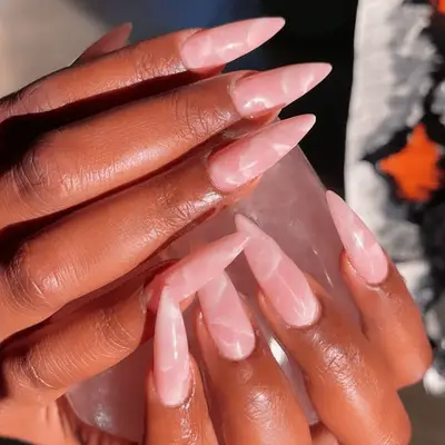 stilleto nails with a rose quartz design
