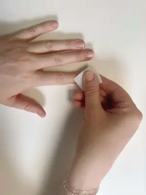 Wiping off nails with an alcohol pad