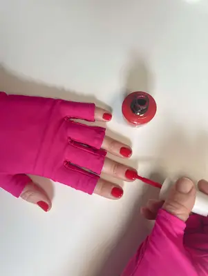 author applies a second coat of polish to her nails