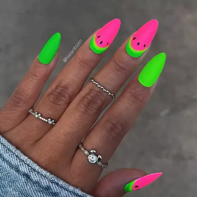 a matte neon green and pink manicure in a watermelon design