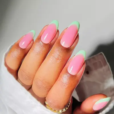 a pink jelly manicure with mint green tips