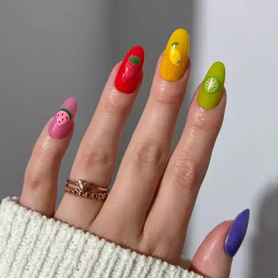 a fruit salad manicure with jelly bases and illustrated fruits