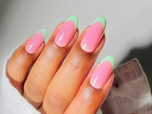 a pink and green french manicure, evoking a watermelon