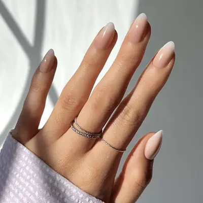 A bottle of Manucurist Paris quick dry nail polish in the shade Shell Beige