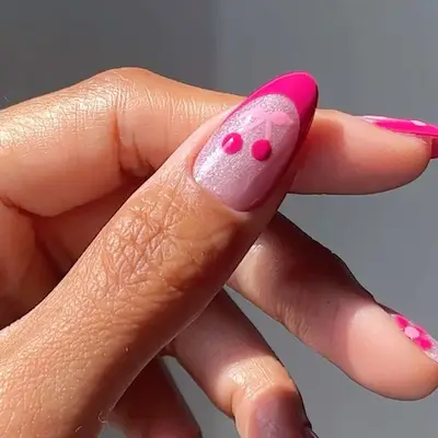 Shimmery pale pink nails with hot pink French tips and cherry accents - MYM Beauty Summer French Manicures