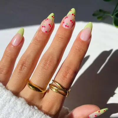 Pistachio French tips with cherry nail art 