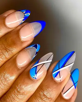 Bright blue French tips with a negative space design 