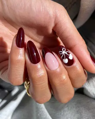 Dark cherry nails with white cherry nail art 