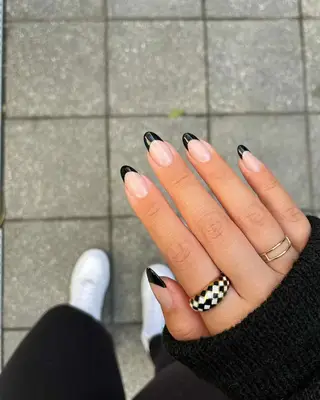 A French manicure with black tips