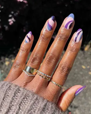A manicure with lavender and plum swirls 