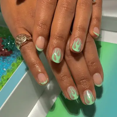 Neon green flame French manicure