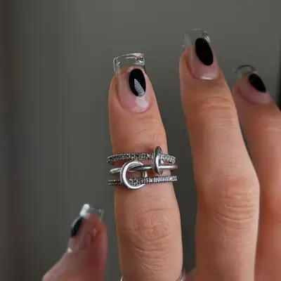 Model with transparent nails with black oval design
