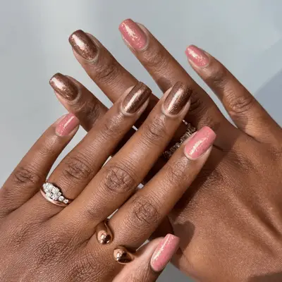 Brown and pink nails with gold glitter