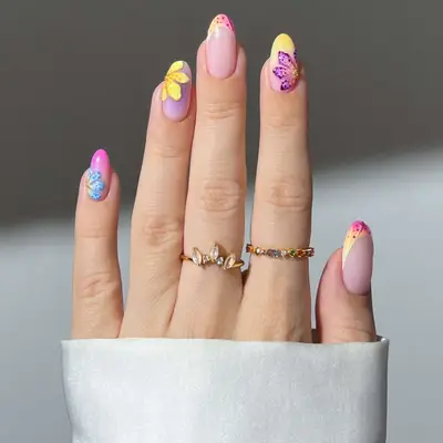 pastel nails with 3d flowers, shades of pink, blue, yellow